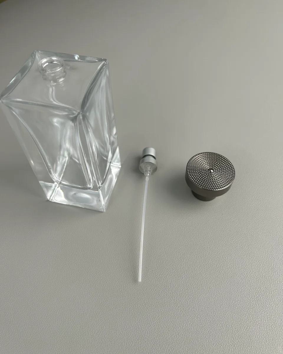 Perfume bottle, cap, pump and dip tube arranged for component fit review