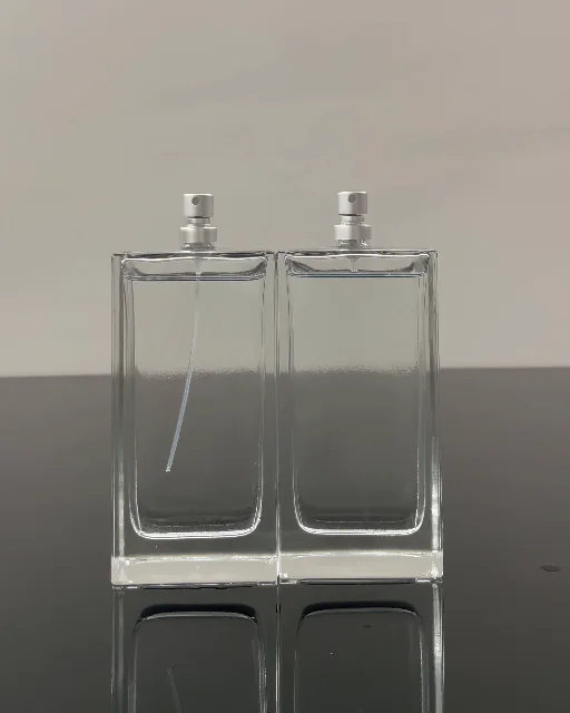 Two glass perfume bottles showing different dip tube visibility